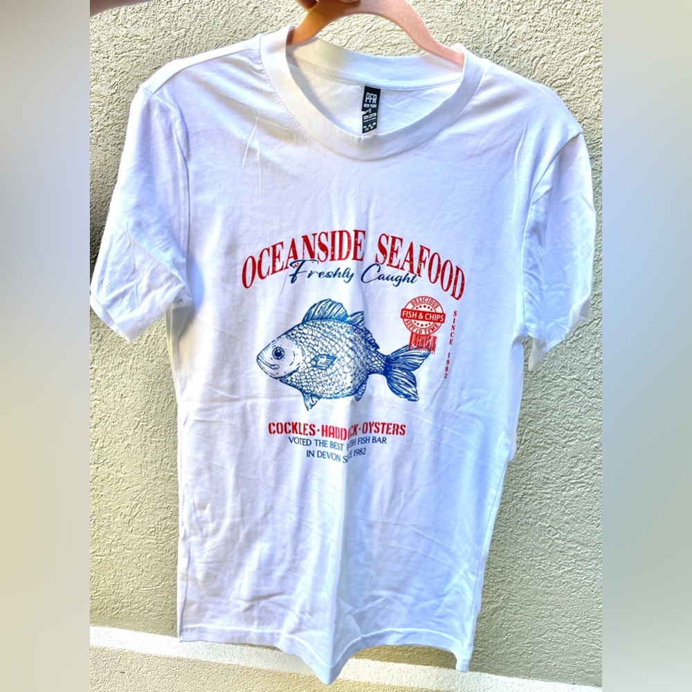 Donating on 7/23!!
100% cotton Tee with Red & Blue Oceanside Seafood Print